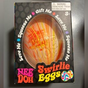 NWT Needoh Swirlie Eggs - Orange and Yellow squishy. Brand new, unopened in box.